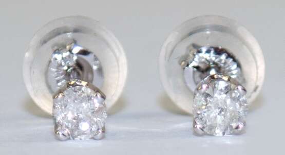 Ohrstecker, 14 k WG, Brillanten von zus. 0,20 ct., Aufstecker aus Silikon mit Goldinlay, ungetragen - фото 1