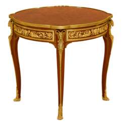 Mahogany table decorated with marquetry in the style of Louis XV, Francois Linke. Late 19th century 