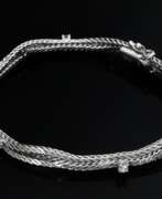 Catalogue des produits. Geflochtenes Weißgold 585 Armband mit Brillantbesatz (zus. ca. 0.31ct/VSI-SI/TW-W), 16,4g, L. 18,8cm