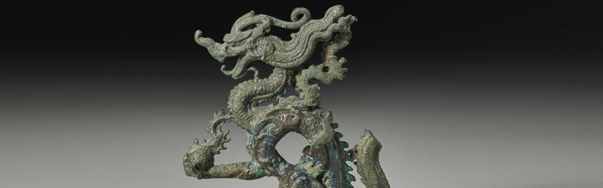 A VERY RARE BRONZE FIGURE OF A DRAGON