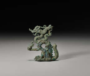 A VERY RARE BRONZE FIGURE OF A DRAGON