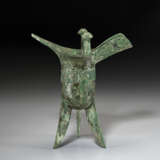 A BRONZE RITUAL TRIPOD WINE VESSEL, JUE - photo 2