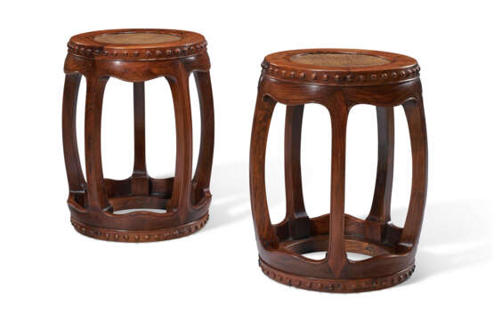 A RARE PAIR OF HUANGHUALI BARREL-FORM STOOLS - photo 1