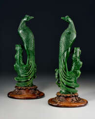 A PAIR OF LARGE GREEN JADE CARVINGS OF PHOENIXES