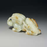 A LARGE AND FINELY CARVED PALE GREENISH-WHITE AND RUSSET JADE `BUDDHIST LION` GROUP - photo 1