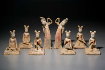 A GROUP OF EIGHT PAINTED POTTERY FIGURES OF FEMALE ENTERTAINERS