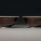 A PAIR OF INCISED AUBERGINE-GLAZED `DRAGON` BOWLS - photo 1