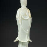 A LARGE GREENISH-WHITE JADE FIGURE OF GUANYIN - photo 2