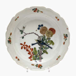 A deep plate with "bird tree decoration"