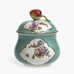 A small sugar bowl with celadon background