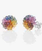 Bijoux d'oreille. A pair of stud earrings decorated with multi-coloured briolette-cut sapphires