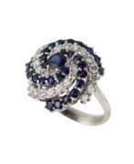 Sapphire. Spiral-shaped gold ring with sapphires and diamonds. 