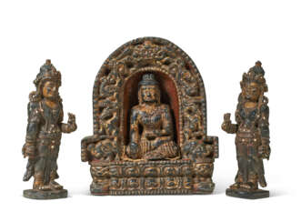 A BLACK STONE TRIAD WITH BUDDHA AND BODHISATTVAS