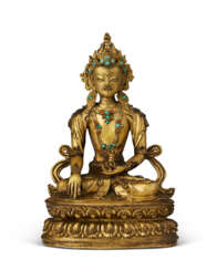 A GILT-BRONZE FIGURE OF AKSHOBYA