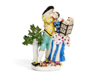 A MEISSEN PORCELAIN GROUP OF COLUMBINE AND SCARAMOUCHE WITH A BIRD CAGE