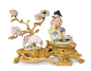 AN ORMOLU-MOUNTED MEISSEN PORCELAIN FIGURE OF A SHEPHERD AND A MODEL OF A SHEEP