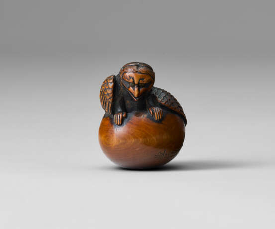 A CARVED WOOD NETSUKE OF TENGU NO TAMAGO - photo 1