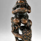 A CARVED WOOD NETSUKE OF ASHINAGA AND TENAGA - photo 1