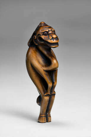 A CARVED WOOD NETSUKE OF A RAIN DRAGON - photo 1