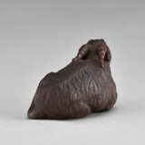 A CARVED WOOD NETSUKE OF A GOAT - фото 4