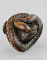 A CARVED WOOD NETSUKE OF A SNAKE AND TURTLE