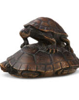 A CARVED WOOD NETSUKE OF A PAIR OF TURTLES
