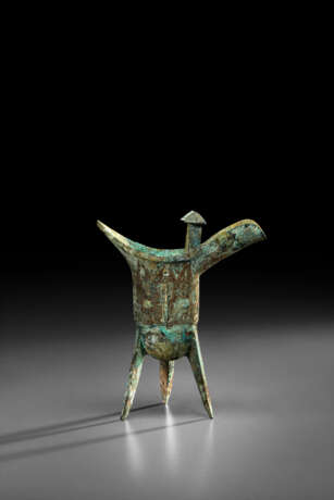 A BRONZE RITUAL TRIPOD WINE VESSEL, JUE - photo 1