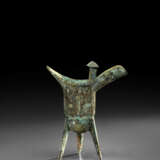 A BRONZE RITUAL TRIPOD WINE VESSEL, JUE - photo 1