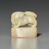 A PALE BROWNISH-WHITE JADE SEAL WITH BUDDHIST LION-FORM FINIAL - photo 1