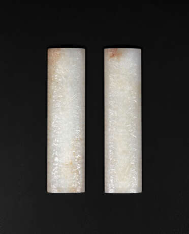 A PAIR OF CARVED WHITE JADE 'DAOIST EMBLEMS' WRIST RESTS - фото 1