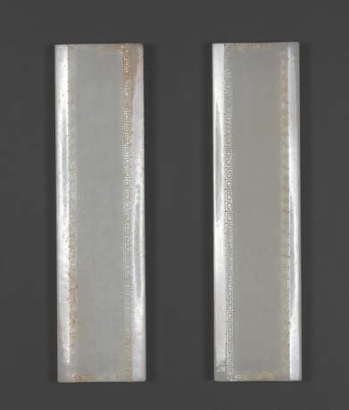 A PAIR OF CARVED WHITE JADE 'DAOIST EMBLEMS' WRIST RESTS - photo 2