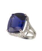 Diamonds. Gold ring with tanzanite and diamonds. 