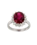 Diamonds. White gold ring with synthetic ruby and diamonds. 