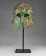 Overview. A GREEK BRONZE CORINTHIAN HELMET