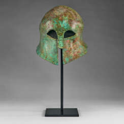 A GREEK BRONZE CORINTHIAN HELMET