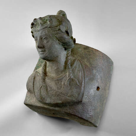 A ROMAN BRONZE SHIP FITTING WITH A BUST OF ARIADNE - photo 1