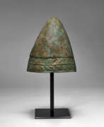 Defensive weapons. A GREEK BRONZE PILOS HELMET