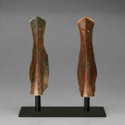 A PAIR OF GREEK BRONZE ANKLE-GUARDS