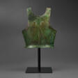 A GREEK BRONZE BREAST-PLATE FROM A BELL CUIRASS - Auction prices