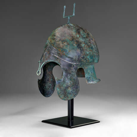 A GREEK BRONZE CHALCIDIAN HELMET WITH SILVER OVERLAYS - photo 1