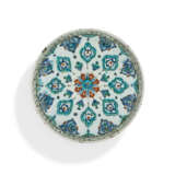 A RIMLESS IZNIK POTTERY DISH - фото 1