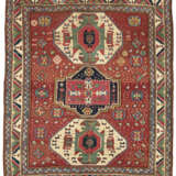 A TRIPLE-MEDALLION KAZAK RUG - photo 1