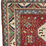 A TRIPLE-MEDALLION KAZAK RUG - photo 4