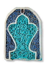 A CARVED AND GLAZED TIMURID POTTERY TILE