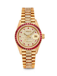 ROLEX. A LADY&#39;S VERY RARE AND IMPRESSIVE 18K GOLD, DIAMOND AND RUBY-SET AUTOMATIC WRISTWATCH WITH SWEEP CENTRE SECONDS, DATE AND BRACELET