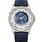 PATEK PHILIPPE. A RARE AND ATTRACTIVE PLATINUM AUTOMATIC WORLD TIME WRISTWATCH - photo 1