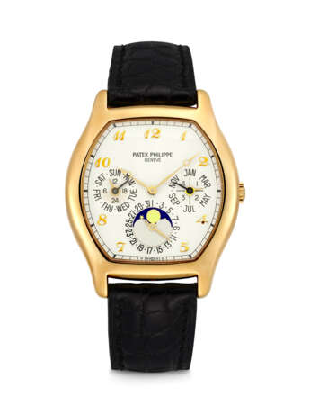 PATEK PHILIPPE. AN 18K GOLD TONNEAU SHAPED PERPETUAL CALENDAR AUTOMATIC WRISTWTACH WITH MOON PHASES, 24 HOUR, LEAP YEAR INDICATION AND BREGUET NUMERALS - photo 1