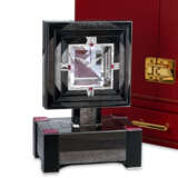 CARTIER. A STUNNING AND EXTREMELY RARE 18K WHITE GOLD, RUBY AND DIAMOND-SET MYSTERY CLOCK WITH ONYX AND OBSIDIAN - фото 1