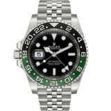 ROLEX. A STAINLESS STEEL AUTOMATIC DUAL TIME LEFT HANDED WRISTWATCH WITH SWEEP CENTRE SECONDS, DATE AND BRACELET - фото 1