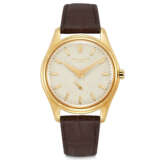 PATEK PHILIPPE. AN 18K GOLD AUTOMATIC WRISTWATCH WITH CREAM-COLOURED ENAMEL DIAL - фото 1